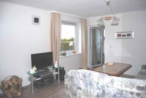 Ruang duduk di Holiday home Ummanz 1