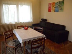 a living room with a table and a couch at Apartment in Balatonboglar/Balaton 18194 in Balatonboglár