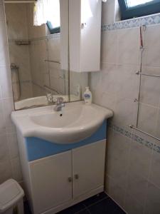 a bathroom with a sink and a shower at Holiday home in Balatonszarszo 20093 in Balatonszárszó +33 photos