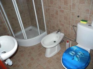 a bathroom with a toilet and a sink and a shower at Holiday home Balatonkenese - Balaton 18975 in Balatonkenese +16 photos