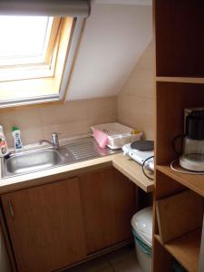 a small kitchen with a sink and a window at Apartment Keszthely 4 in Keszthely