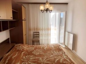 a bedroom with a large bed and a window at Apartment Kampor 3 in Kampor