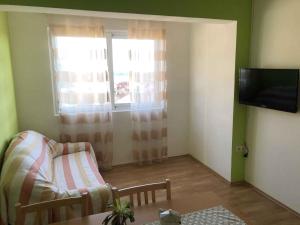 Televízia a/alebo spoločenská miestnosť v ubytovaní Apartment Kampor 3