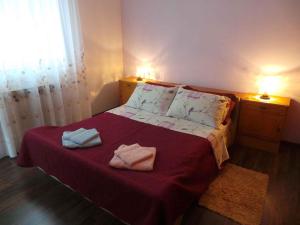 Postel nebo postele na pokoji v ubytování Apartment Lovran 15546