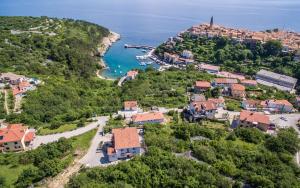 an aerial view of a village on a hill with the ocean at Apartment in Vrbnik/Insel Krk 13612 in Vrbnik