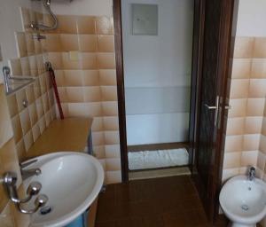 a bathroom with a sink and a shower and a toilet at Apartment in Pula/Istrien 10835 in Vintijan
