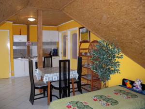 A kitchen or kitchenette at House and Apartment Balatonmariafürdo 19319