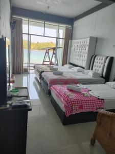 Una cama o camas en una habitación de Mr. Bean Resort