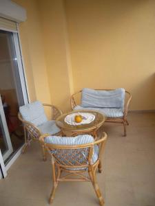 a table and chairs in a room with a table and chairs at Apartment Liznjan 5 in Ližnjan