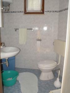 a bathroom with a toilet and a sink at Holiday home in Premantura - Istrien 10653 in Premantura