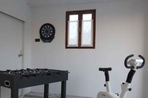 a room with a table and a dartboard on a wall at Holiday home in Buzet - Istrien 9974 in Buzet