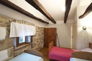 a bedroom with two beds and a window in a building at Holiday home in Buzet - Istrien 9974 in Buzet +17 photos