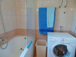 a bathroom with a washing machine and a shower at Holiday home in Banjole/Istrien 10808 in Banjole