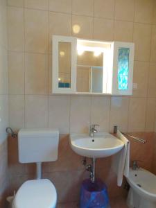 a bathroom with a toilet and a sink at Holiday home in Banjole/Istrien 10808 in Banjole