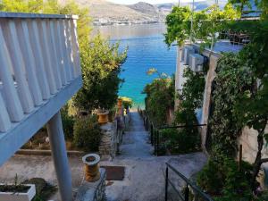 a stairway leading down to a body of water at Apartment Trogir 6 in Okrug Donji