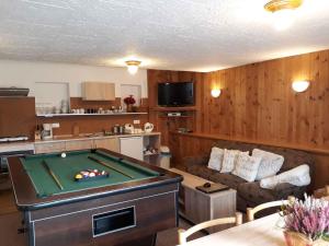 a living room with a pool table in it at Apartment Svoboda nad upou 2 in Svoboda nad Úpou