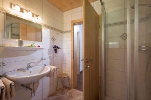 a bathroom with a sink and a shower at Apartment Zell am Ziller 2 in Zell am Ziller