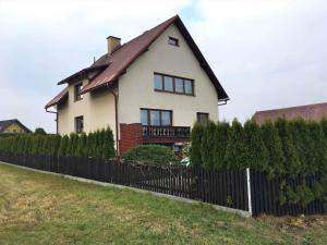 a house with a fence in front of it at Apartment in Martinice v Krkonosich 2422 in Martinice