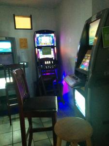a room with a video game machine and a chair at The Bridgewater Hotel in Bridgewater