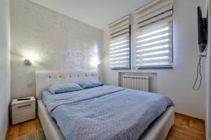 Ένα ή περισσότερα κρεβάτια σε δωμάτιο στο Apartman Nataša