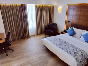 The Fern Residency, Jamnagar客房内的一张或多张床位