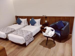 The Fern Residency, Jamnagar客房内的一张或多张床位