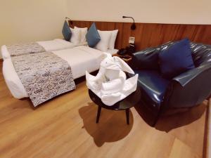 The Fern Residency, Jamnagar客房内的一张或多张床位