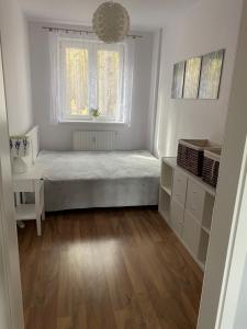 Posteľ alebo postele v izbe v ubytovaní Apartament Wiewiórka