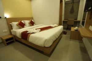 Postelja oz. postelje v sobi nastanitve VIPs Hotel Olive