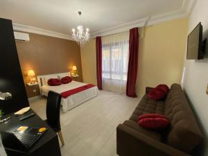 a living room with a bed and a couch at Apartment San Carlos Alicante II in Alicante