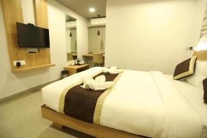 Postelja oz. postelje v sobi nastanitve VIPs Hotel Olive