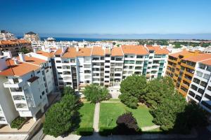 an aerial view of a city with apartment buildings at Lighthouse View in Cascais in Cascais