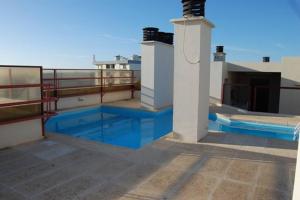 a swimming pool on the roof of a house at Lighthouse View in Cascais in Cascais