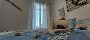 a bedroom with a bed with pumpkins on it at Symi . VILLA CALME (Sur la Mer). in Symi