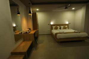 Postelja oz. postelje v sobi nastanitve VIPs Hotel Olive