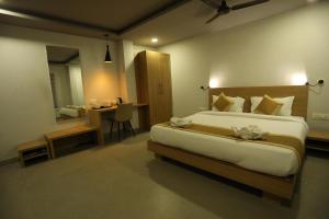 Postelja oz. postelje v sobi nastanitve VIPs Hotel Olive