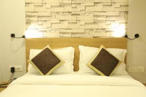 Postelja oz. postelje v sobi nastanitve VIPs Hotel Olive