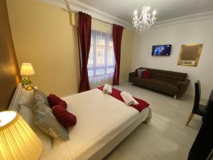 a bedroom with a large bed and a living room at Apartment San Carlos Alicante II in Alicante