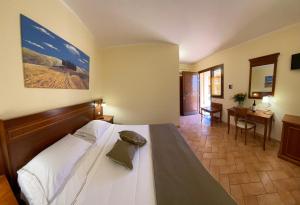 Katil atau katil-katil dalam bilik di Hotel Ristorante Le Querciolaie dei Ricci