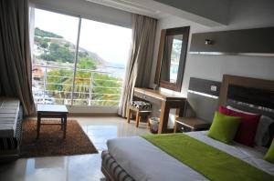 Postel nebo postele na pokoji v ubytování Marina Prestige Tabarka + 14 fotografií