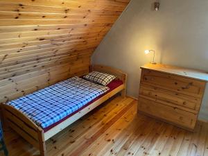 Postel nebo postele na pokoji v ubytování DOMEK 64
