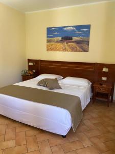 Katil atau katil-katil dalam bilik di Hotel Ristorante Le Querciolaie dei Ricci