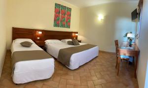 Katil atau katil-katil dalam bilik di Hotel Ristorante Le Querciolaie dei Ricci