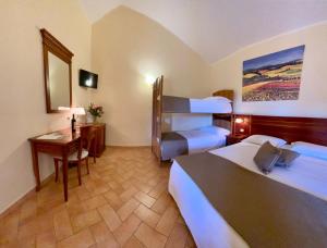 Katil atau katil-katil dalam bilik di Hotel Ristorante Le Querciolaie dei Ricci