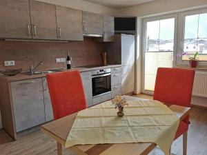 A kitchen or kitchenette at Pension Tannheim