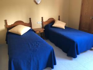 Postel nebo postele na pokoji v ubytování HOSTAL COSTA SOL