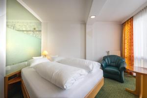 Postel nebo postele na pokoji v ubytování AAAA Hotelwelt KÜBLER