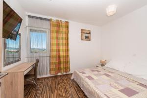 Posteľ alebo postele v izbe v ubytovaní Antonio Apartments