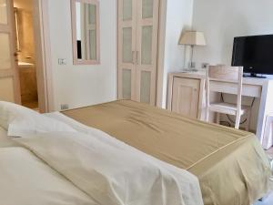 Postel nebo postele na pokoji v ubytování Hotel Alta La Vista