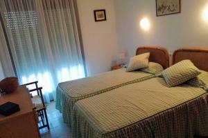 Posteľ alebo postele v izbe v ubytovaní Apartamento con terraza en la playa de La Fosca